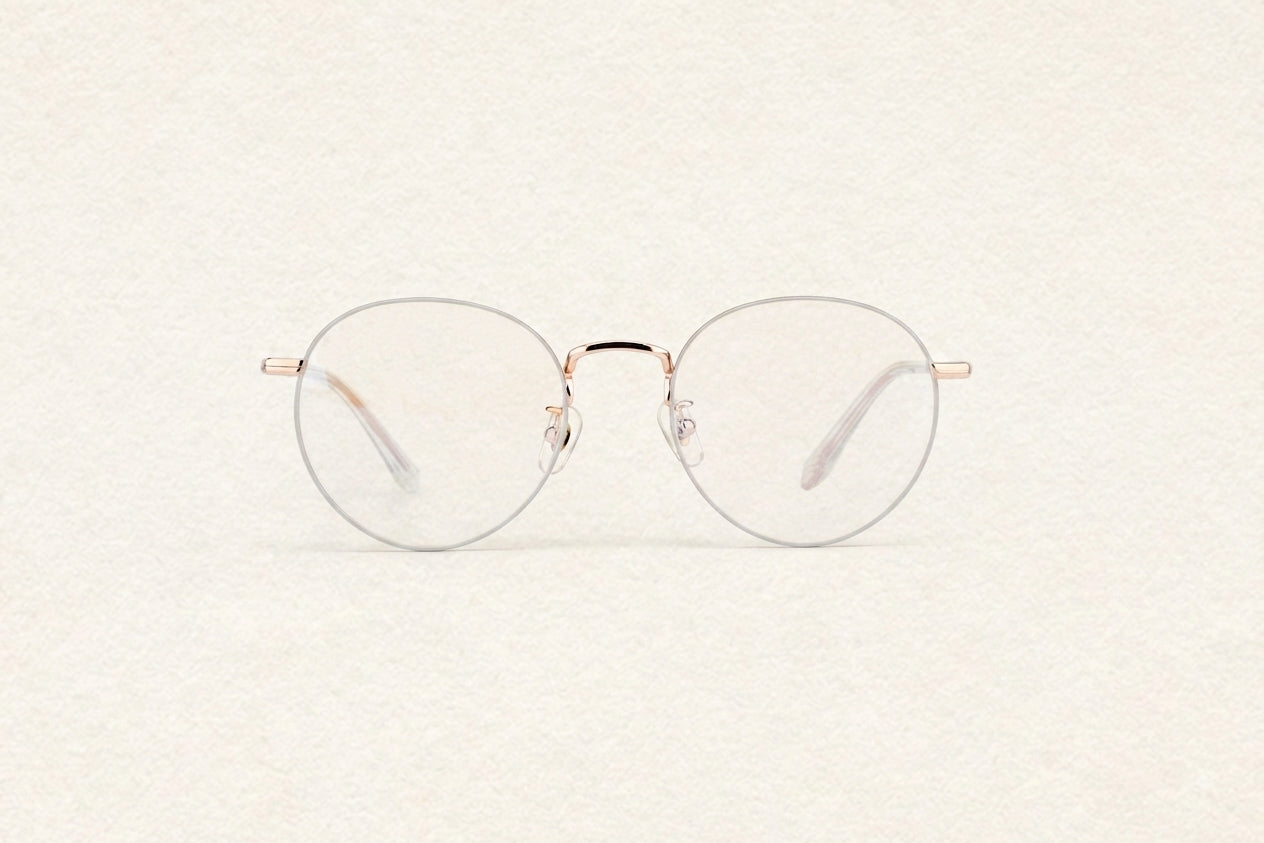 V2604 Full Rim Round Eyeglasses ultra thin rose gold wire vintage round metal optical frame women fashion front view on neutral textured background